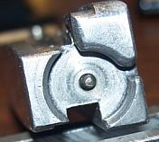 Firing pin protruding from bolt face